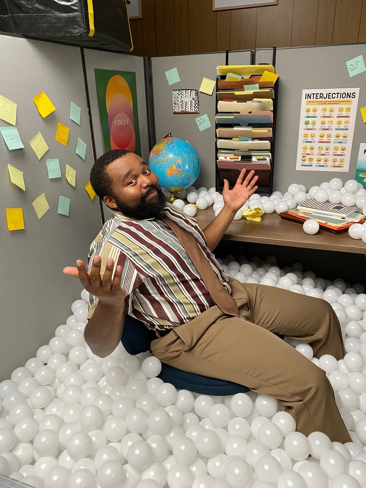 A cubicle turned ball pit for a shoot