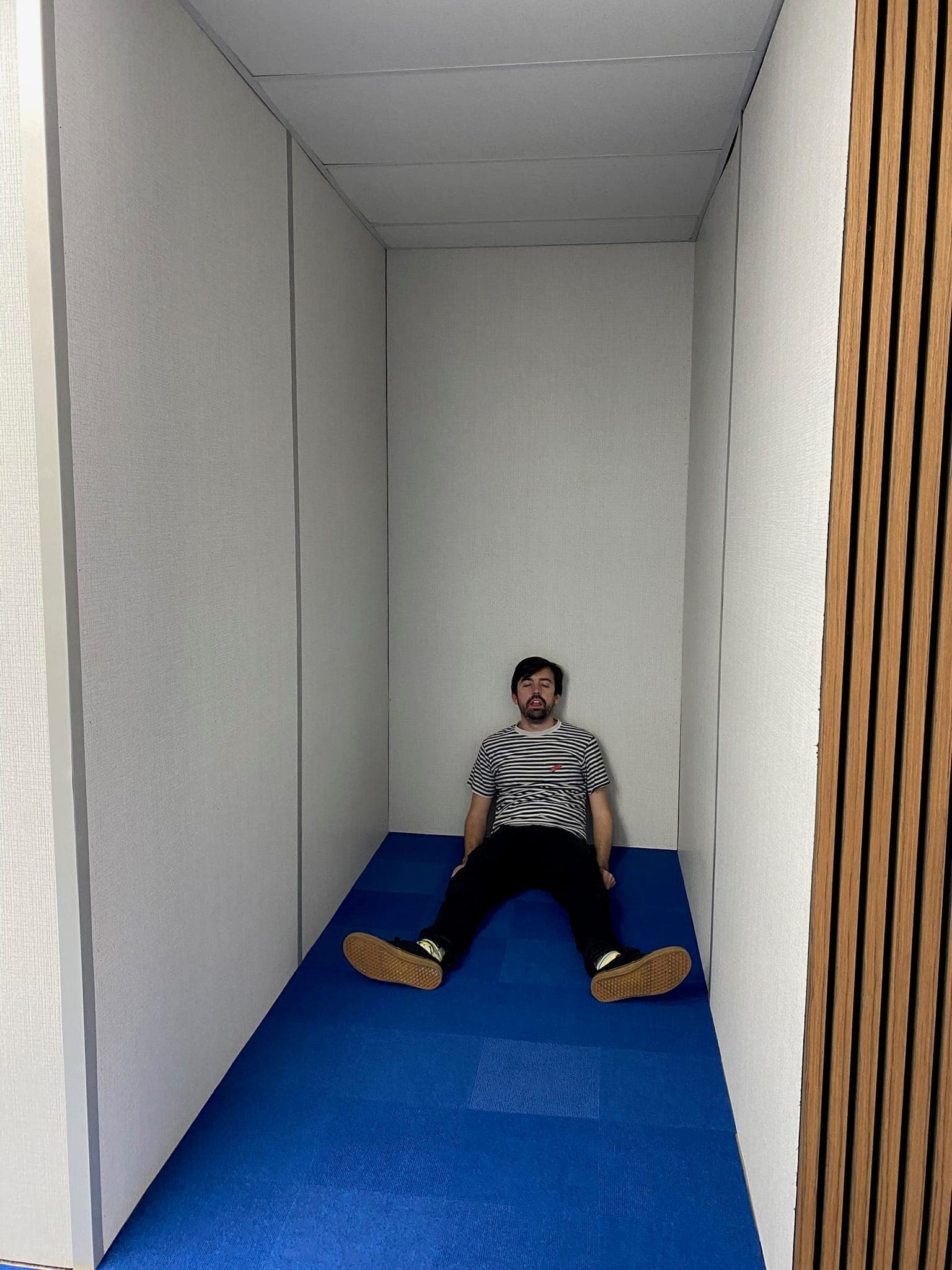 Testing a set piece in a narrow blue hallway