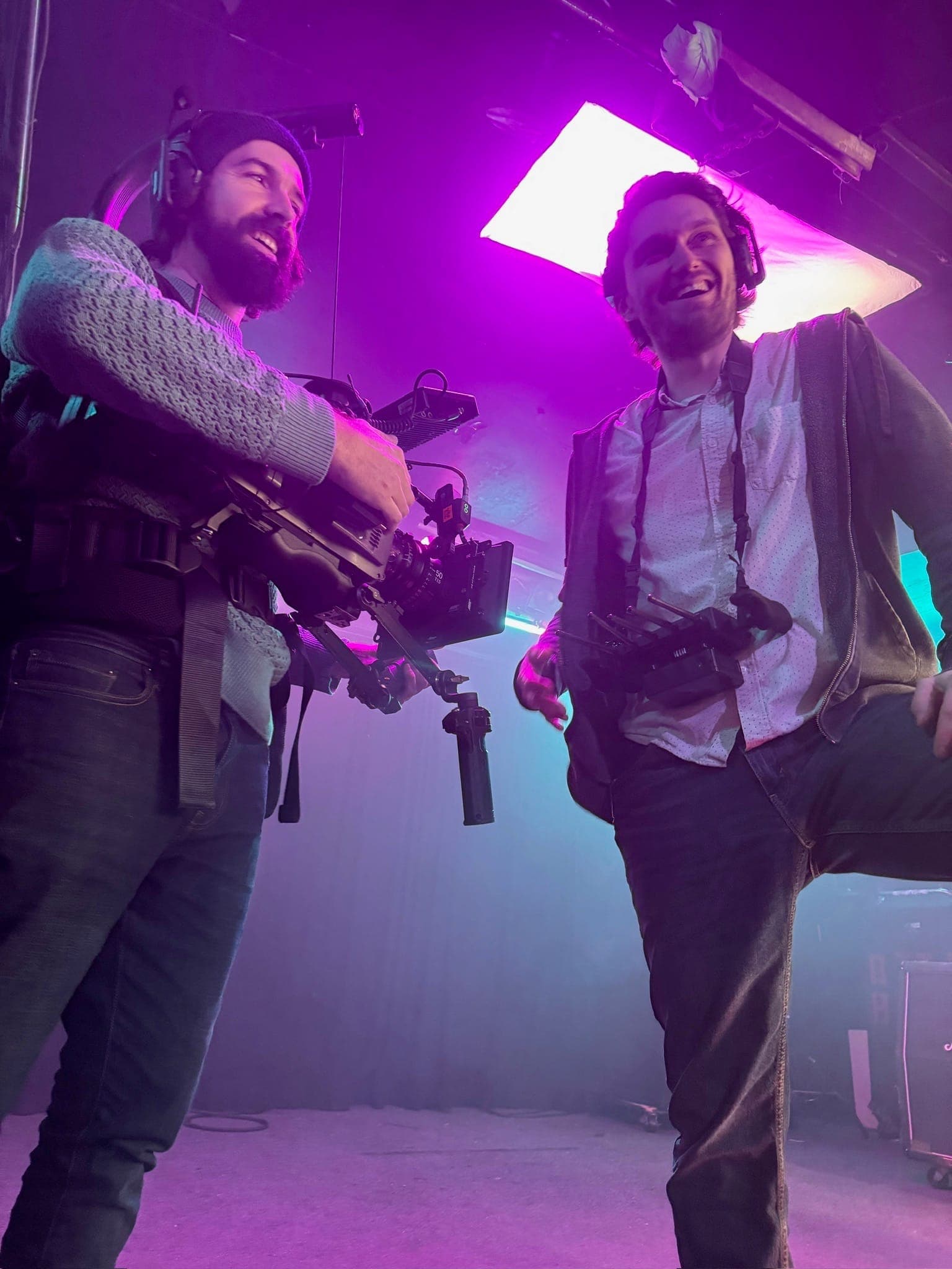 Camera department wrapping a lit set piece